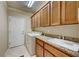 Bright laundry room, featuring washer, dryer, and ample cabinetry at 2589 Sumter St, Henderson, NV 89052