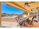 Covered patio with dining furniture and pool views at 2589 Sumter St, Henderson, NV 89052