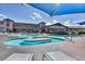 Community pool with a separate spa and seating area at 2589 Sumter St, Henderson, NV 89052