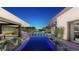 Private backyard with a reflecting pool and seating areas at 2635 Juniper Branch St, Las Vegas, NV 89117