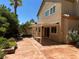 Backyard patio with covered seating area and lush landscaping at 2908 Channel Bay Dr, Las Vegas, NV 89128