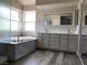 Primary bathroom with a large soaking tub and double vanity at 2908 Channel Bay Dr, Las Vegas, NV 89128