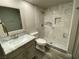 Modern bathroom featuring marble shower and vanity at 2908 Channel Bay Dr, Las Vegas, NV 89128