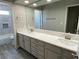 Double vanity bathroom with marble countertops at 2908 Channel Bay Dr, Las Vegas, NV 89128