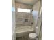 Clean bathroom with marble tile and a shower/tub combo at 2908 Channel Bay Dr, Las Vegas, NV 89128