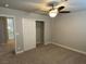 Bright bedroom with ceiling fan and sliding closet doors at 2908 Channel Bay Dr, Las Vegas, NV 89128