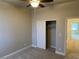 Spacious bedroom with ceiling fan and large closet at 2908 Channel Bay Dr, Las Vegas, NV 89128