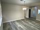 Dining room features wood-look floors and an open floor plan at 2908 Channel Bay Dr, Las Vegas, NV 89128