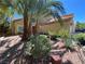 Mediterranean style home with palm trees and drought-tolerant landscaping at 2908 Channel Bay Dr, Las Vegas, NV 89128