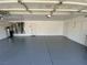 Spacious two-car garage with epoxy flooring and extra storage at 2908 Channel Bay Dr, Las Vegas, NV 89128