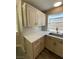 Kitchen corner sink with modern gold faucet and white cabinets at 2908 Channel Bay Dr, Las Vegas, NV 89128