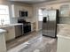 Renovated kitchen featuring stainless steel appliances and light-colored cabinetry at 2908 Channel Bay Dr, Las Vegas, NV 89128