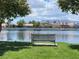 Relaxing lakefront park with bench and scenic mountain views at 2908 Channel Bay Dr, Las Vegas, NV 89128