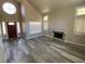 Living room with high ceilings, fireplace and large windows at 2908 Channel Bay Dr, Las Vegas, NV 89128