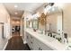 Spa-like bathroom with double vanity and hexagon tile floors at 2924 Rain Lily Ct, Las Vegas, NV 89117