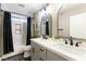 Modern bathroom with double vanity, white subway tile, and freestanding tub at 2924 Rain Lily Ct, Las Vegas, NV 89117