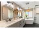 Elegant bathroom with double vanity and hexagon floor tile at 2924 Rain Lily Ct, Las Vegas, NV 89117