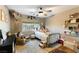 Cozy bedroom with metal bed frame, rocking chair, and floating shelves at 2924 Rain Lily Ct, Las Vegas, NV 89117