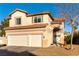 Two-story home with attached garage and landscaped yard at 2924 Rain Lily Ct, Las Vegas, NV 89117