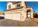 Two-story house with three-car garage and landscaping at 2924 Rain Lily Ct, Las Vegas, NV 89117