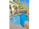 Inviting kidney-shaped pool with waterfall feature at 2924 Rain Lily Ct, Las Vegas, NV 89117