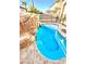 Inviting kidney-shaped pool with waterfall feature at 2924 Rain Lily Ct, Las Vegas, NV 89117