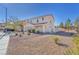 Two-story house with attached garage and desert landscaping at 3257 Aiken St, North Las Vegas, NV 89032