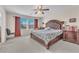 Large main bedroom with plush carpeting and an ensuite bathroom at 3257 Aiken St, North Las Vegas, NV 89032