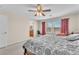 Main bedroom featuring a king-size bed and plenty of natural light at 3257 Aiken St, North Las Vegas, NV 89032