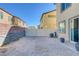 Empty backyard with gravel and privacy fence at 3844 Juanita May Ave, North Las Vegas, NV 89032