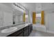 Elegant bathroom with double sinks and a soaking tub at 3844 Juanita May Ave, North Las Vegas, NV 89032