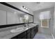 Modern bathroom with double sinks and granite countertop at 3844 Juanita May Ave, North Las Vegas, NV 89032