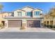 Two-story house with brown double garage and landscaped front yard at 3844 Juanita May Ave, North Las Vegas, NV 89032