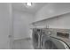 Laundry room with washer, dryer, and shelving at 3844 Juanita May Ave, North Las Vegas, NV 89032