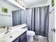 Bathroom with single sink vanity and shower/tub combo at 3905 Blairmoor St, North Las Vegas, NV 89032