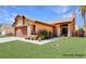 Inviting exterior view of a single-story home with a manicured lawn and cozy facade at 3905 Blairmoor St, North Las Vegas, NV 89032