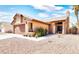 House with brown garage door and small front yard with plants at 3905 Blairmoor St, North Las Vegas, NV 89032