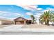 Single story home with brown garage door and gravel landscaping at 3905 Blairmoor St, North Las Vegas, NV 89032