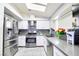 Bright kitchen with stainless steel appliances and white cabinetry at 3905 Blairmoor St, North Las Vegas, NV 89032