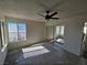 Spacious bedroom featuring a ceiling fan and large windows at 4017 Danford Pl, Las Vegas, NV 89102