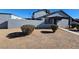 View of the home's side and backyard, showing a small patio area at 4017 Danford Pl, Las Vegas, NV 89102