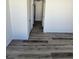 Clean hallway with light walls and new grey vinyl flooring at 4017 Danford Pl, Las Vegas, NV 89102