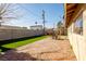 Artificial turf backyard with patio and play structures at 4116 E Ogden Ave, Las Vegas, NV 89110