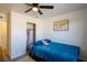 Cozy bedroom with a full-size bed, ample closet space, and world map decor at 4116 E Ogden Ave, Las Vegas, NV 89110