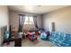 Playful bedroom with a twin bed, colorful toys, and a ' sofa at 4116 E Ogden Ave, Las Vegas, NV 89110