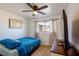 Serene bedroom with a full-size bed, TV, and neutral color palette at 4116 E Ogden Ave, Las Vegas, NV 89110