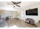 Living room with hardwood floors, large TV, and open concept design at 4116 E Ogden Ave, Las Vegas, NV 89110