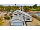 Aerial view of a lovely two-story home surrounded by mature trees in a quiet neighborhood at 5236 Woodlawn Ln, Las Vegas, NV 89130