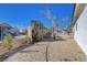 Landscaped backyard with gravel and a fence at 5236 Woodlawn Ln, Las Vegas, NV 89130