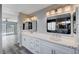 Double vanity bathroom with quartz countertops and modern fixtures at 5236 Woodlawn Ln, Las Vegas, NV 89130